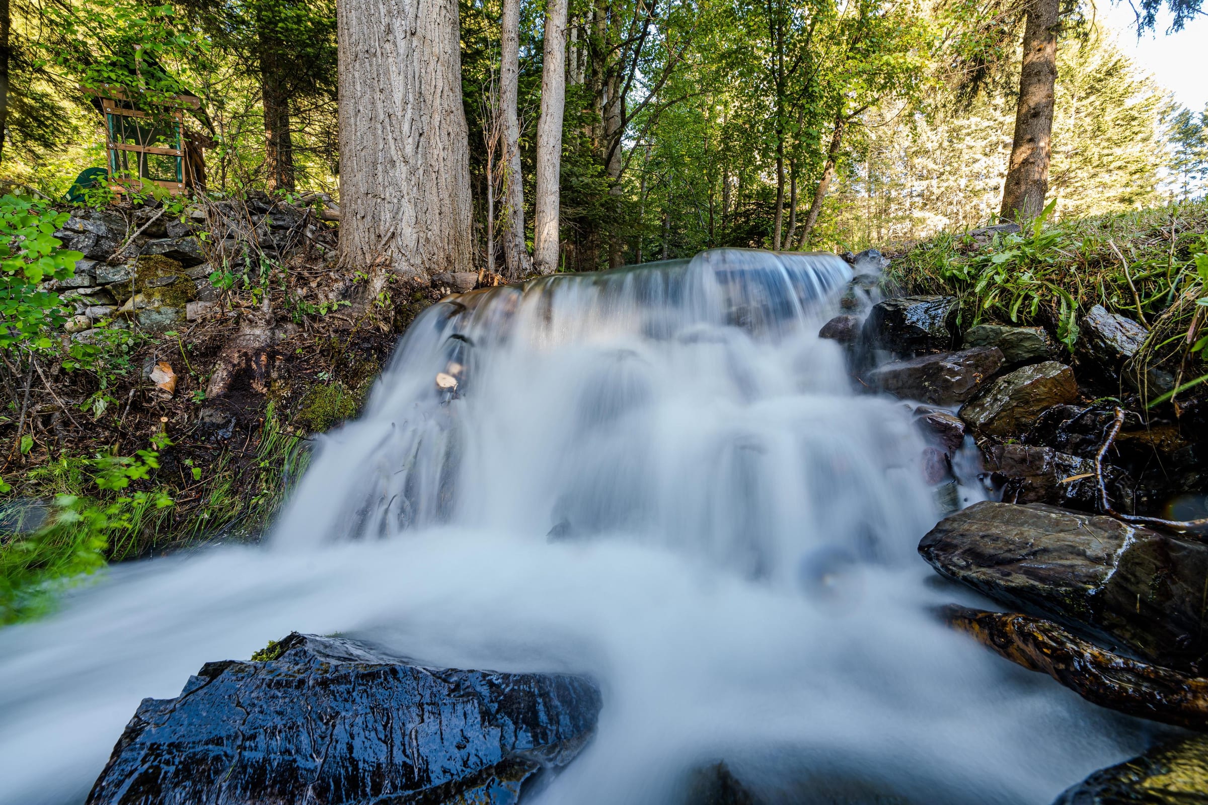 The cascading waterfall just outside Twin Creeks Cabin